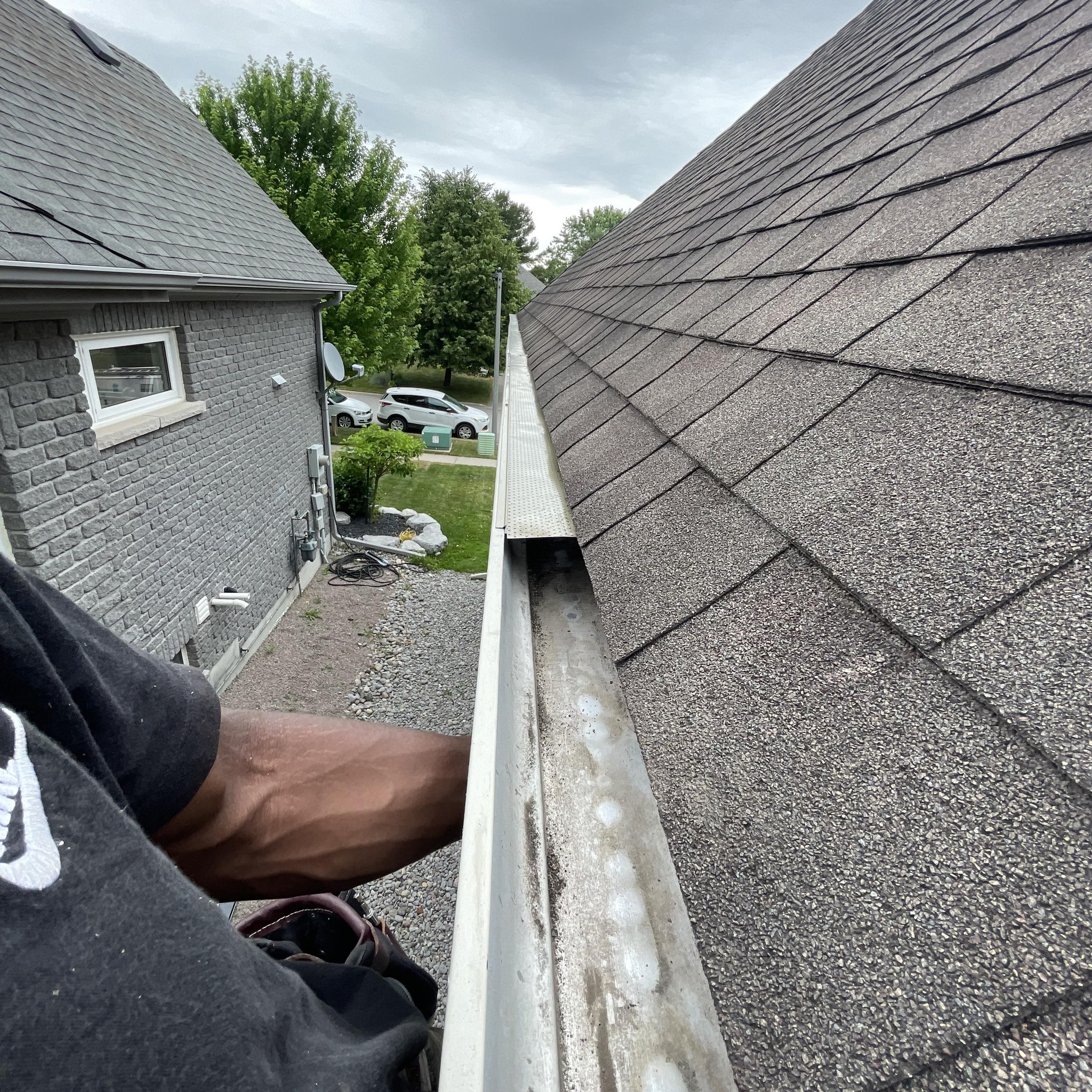 Gutter cleaning in progress